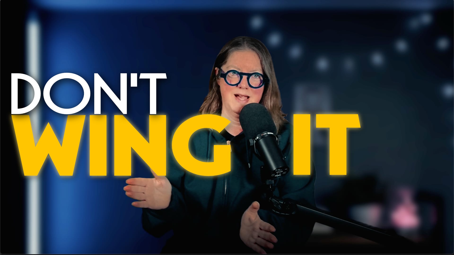 Jen in front of dark blue background and behind mic with words "Don't Wing it"