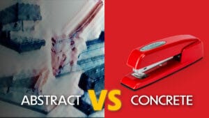 blurry image of staplers next to a crisp and clear photo of a red swingline stapler with text on top that reads "Abstract vs Concrete"